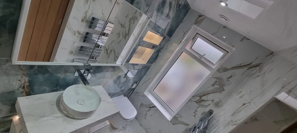 Full bathroom view with walk-in shower and floating toilet in Blyth