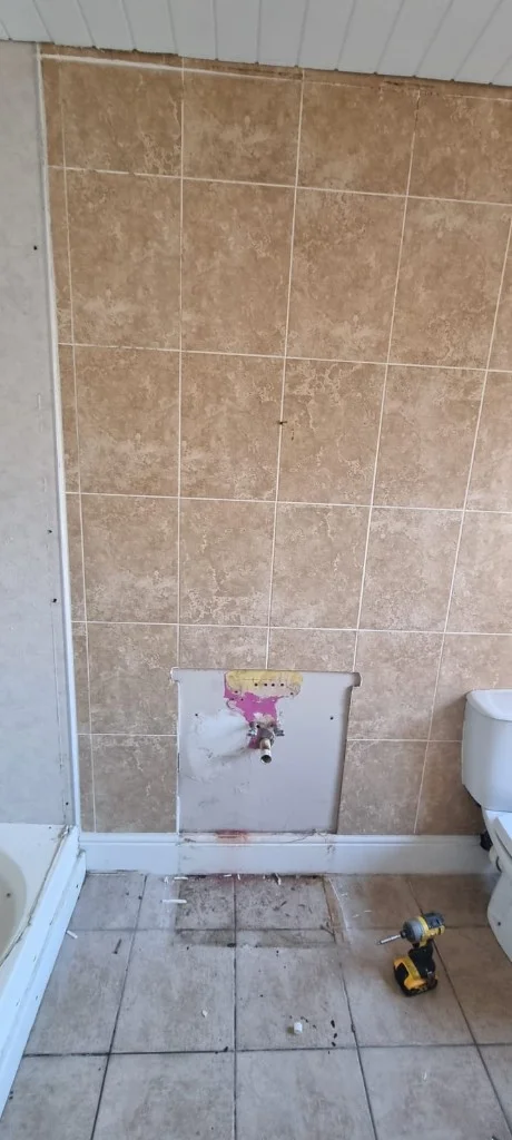 Dated bathroom wall before renovation in Blyth