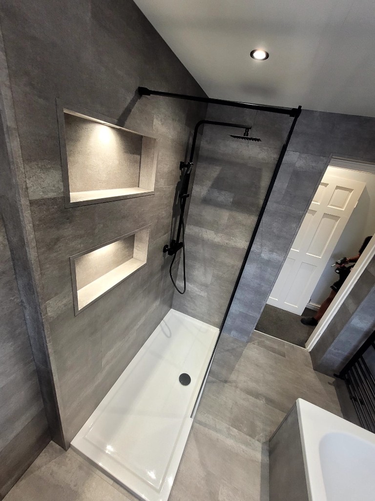 Walk-in shower with LED-lit niches and matte black fittings in Boldon