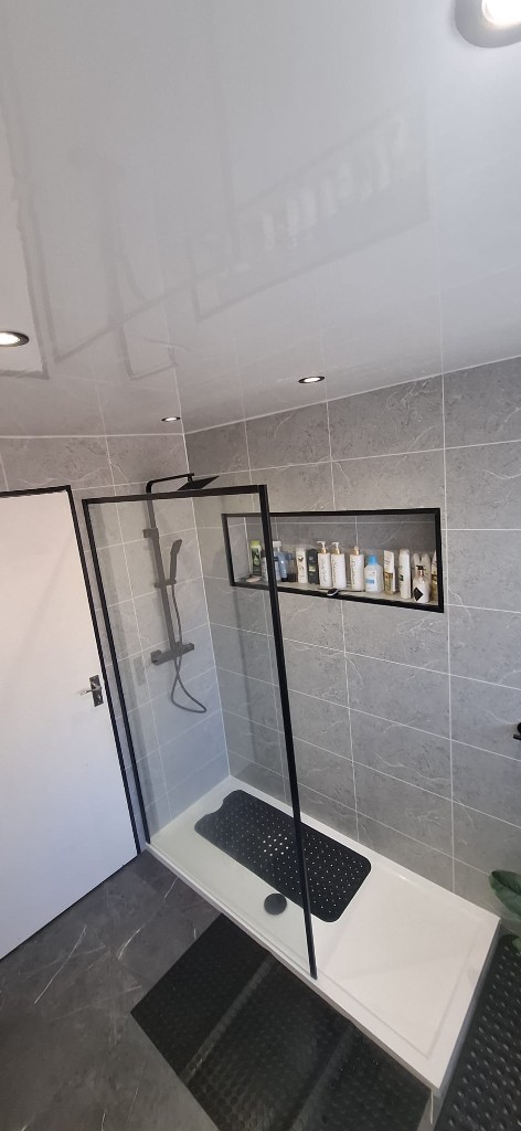 Walk-in shower with black screen, rainfall head and recessed niche in South Shields