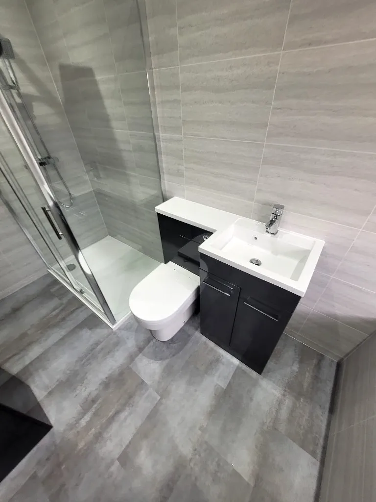 Shower quadrant and anthracite toilet & vanity combination unit in Durham