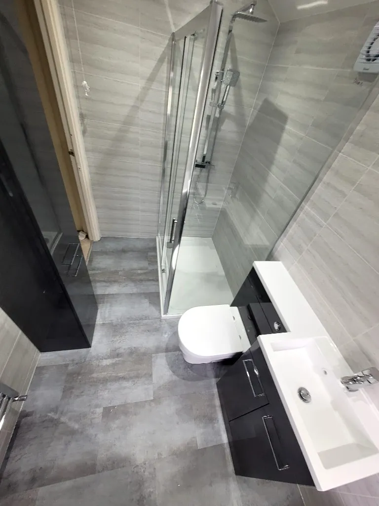 Full bathroom view with shower, bath and cladded walls in Durham