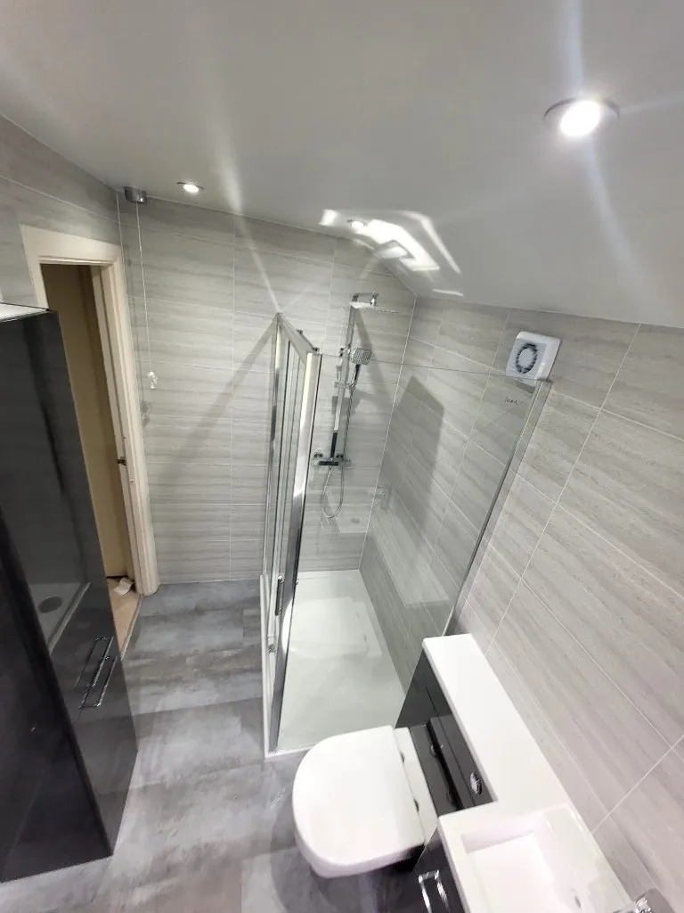 Shower quadrant, tall unit and vanity in cladded Durham bathroom