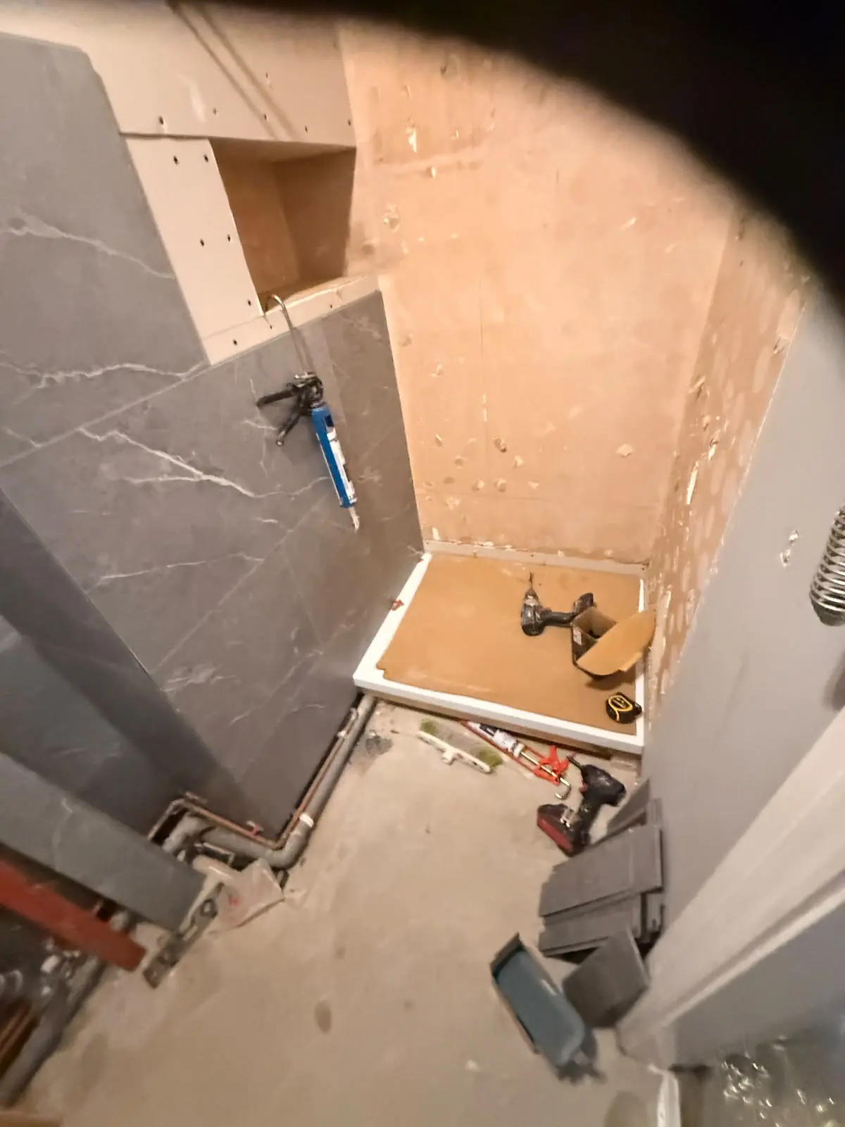 SPC marble wall panels and recessed niche being fitted in Durham shower area